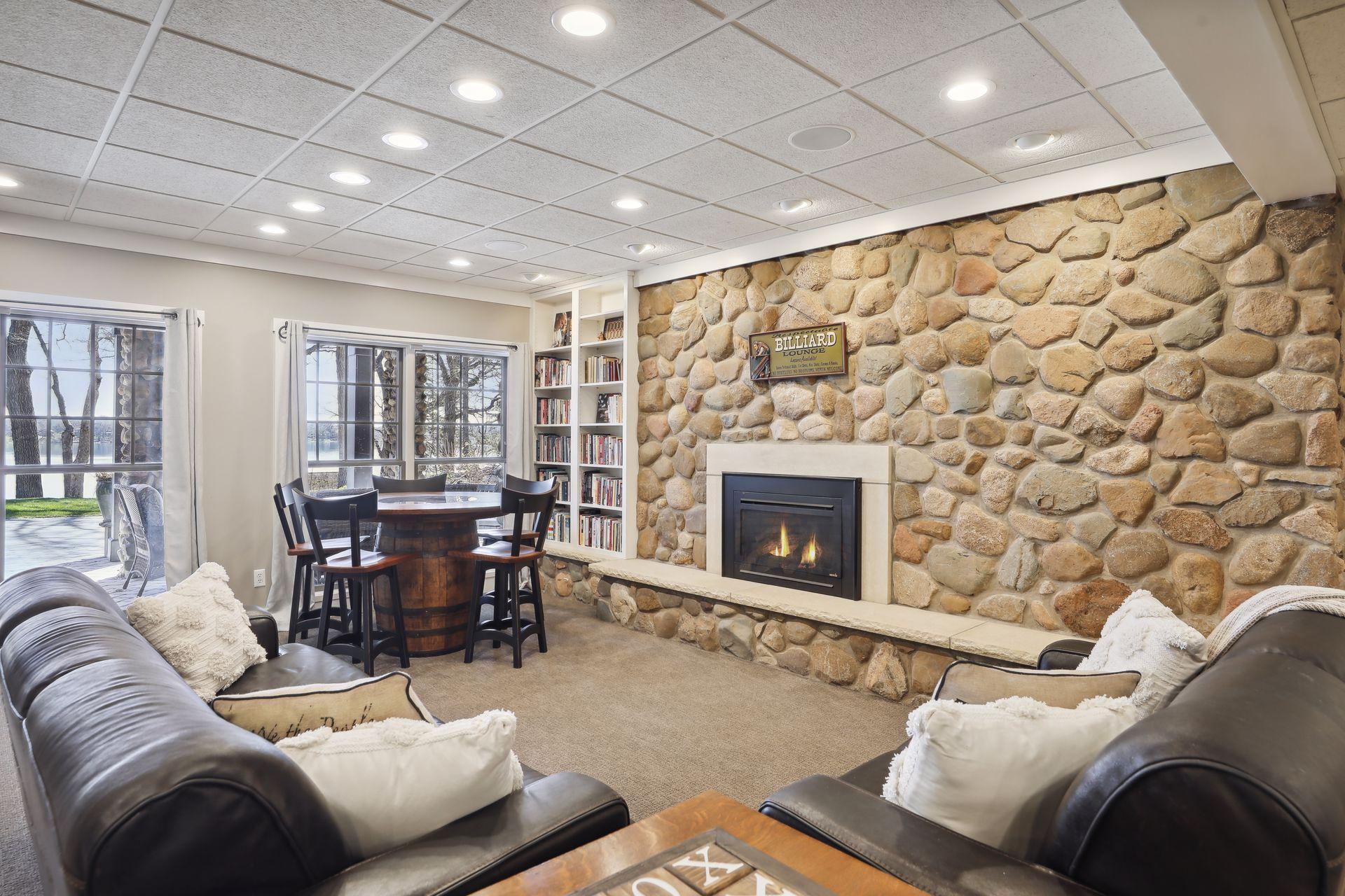 Recreation Room features stunning lake views and gas fireplace