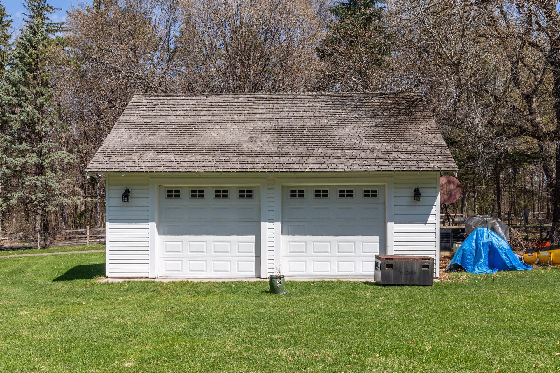 The heated, detached 2-car Garage is oversized