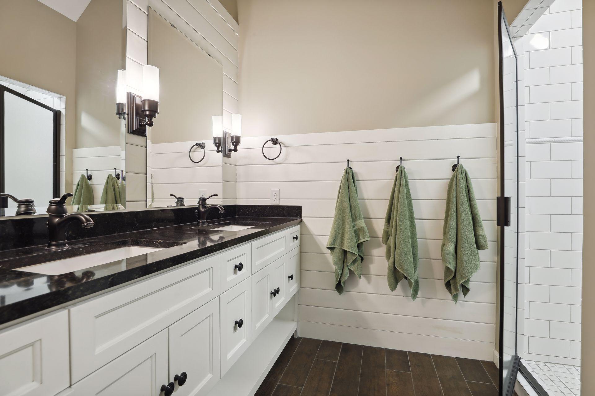 En-suite Bath features double sinks and spacious step-in shower