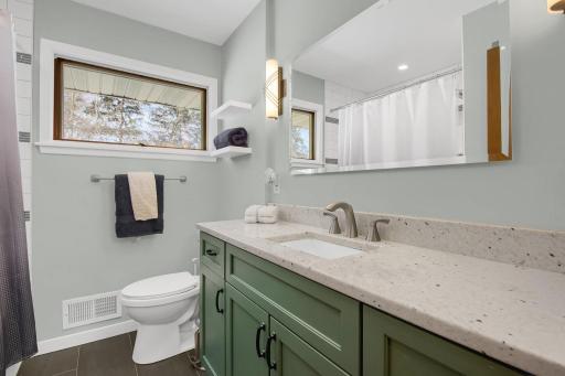 The main floor bathroom was completely gutted & professionally remodeled in 2022. Featuring granite counters, tile heated floors, new lighting & soaker tub.