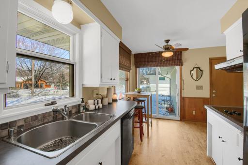 The Kitchen is large enough to have a seating area. It also l=walks out to the backyard via sliding glass doors.
