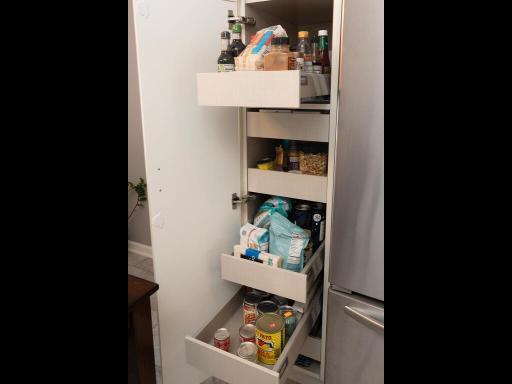 Convenient pull out cabinets for your pantry items.
