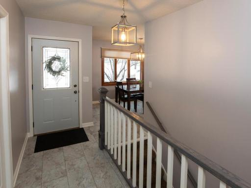 Newer flooring and light fixtures as you enter the home