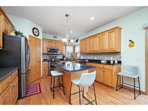 Updated kitchen with Cambria countertops and newer SS appliances