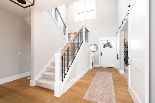Wecoming guests into this spacious 2-story entry way off of your front porch