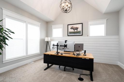 Large main level office #1 with large windows and vaulted ceiling