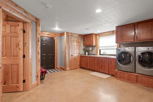 Huge laundry/mudroom with heated floors and lots of storage space