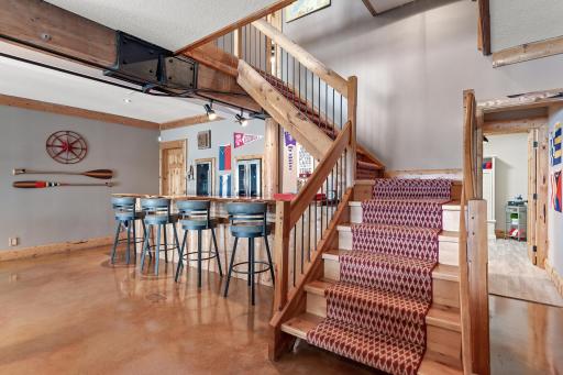 Wet bar with built-in beverage refrigerators and counter seating
