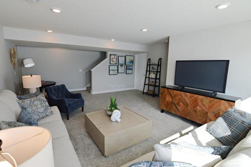 All of that living space up, PLUS this lower level family room - perfect for movie nights or catching the big game!!