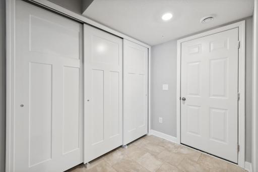 Spacious mudroom entry from the garage. Photos not of actual home. Actual home will be similar floorplan; some colors and features may vary.