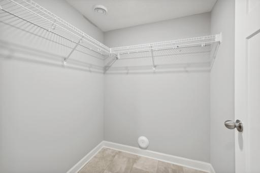Finished the lower level with a large walk-in closet. Photos not of actual home. Actual home will be similar floorplan; some colors and features may vary.