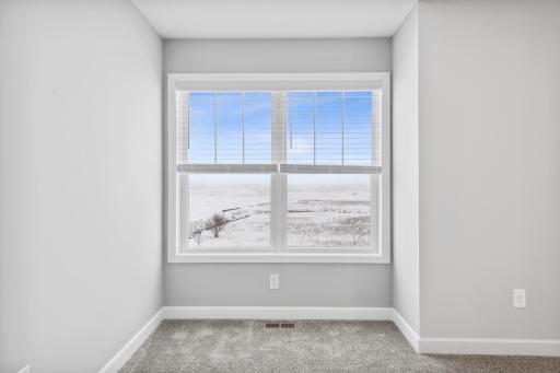 Plenty of windows for a sunlit room. Photos not of actual home. Actual home will be similar floorplan; some colors and features may vary.