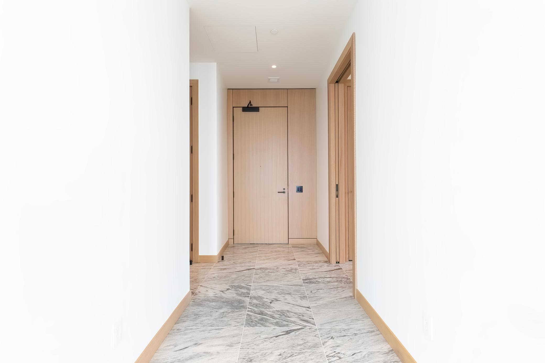 Grand entrance with lovely marble floors and lots of closet/storage space. This home is pure class & has never been lived in.