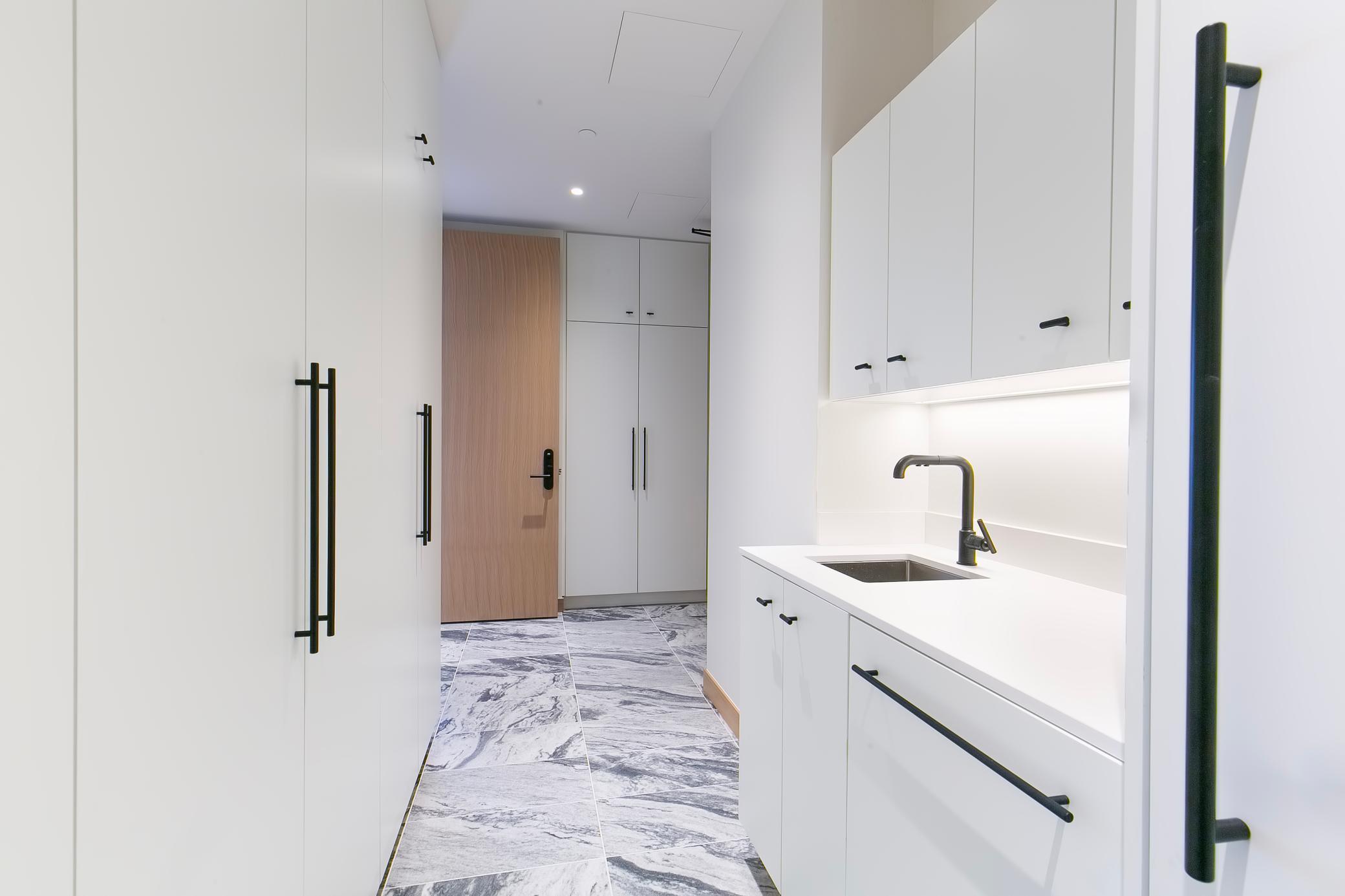 2nd entrance area with additional refrigerator/freezer, sink and lots of extra storage space.