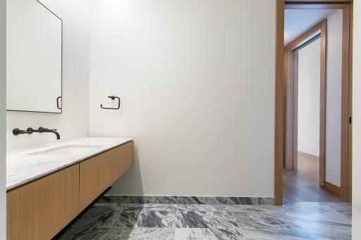 Bathroom with heated marble flooring and stunning walk-in shower stall.