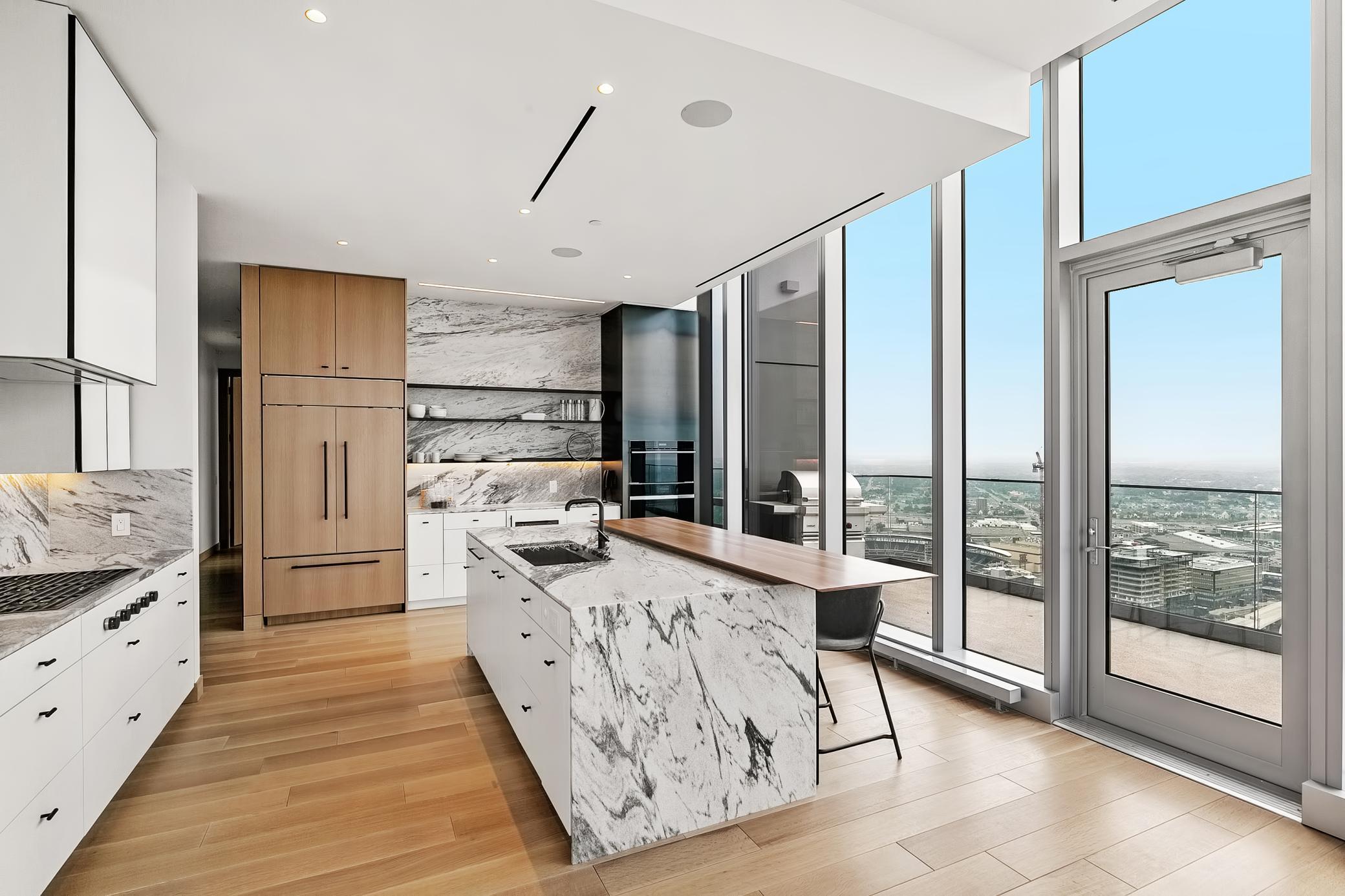 Gorgeous marble countertops, gleaming Oak floors, open concept floor plan, gourmet kitchen complete with state-of-the-art appliances & extraordinary custom cabinetry & remarkable finishes in every space & dimmable under-cabinet lighting,