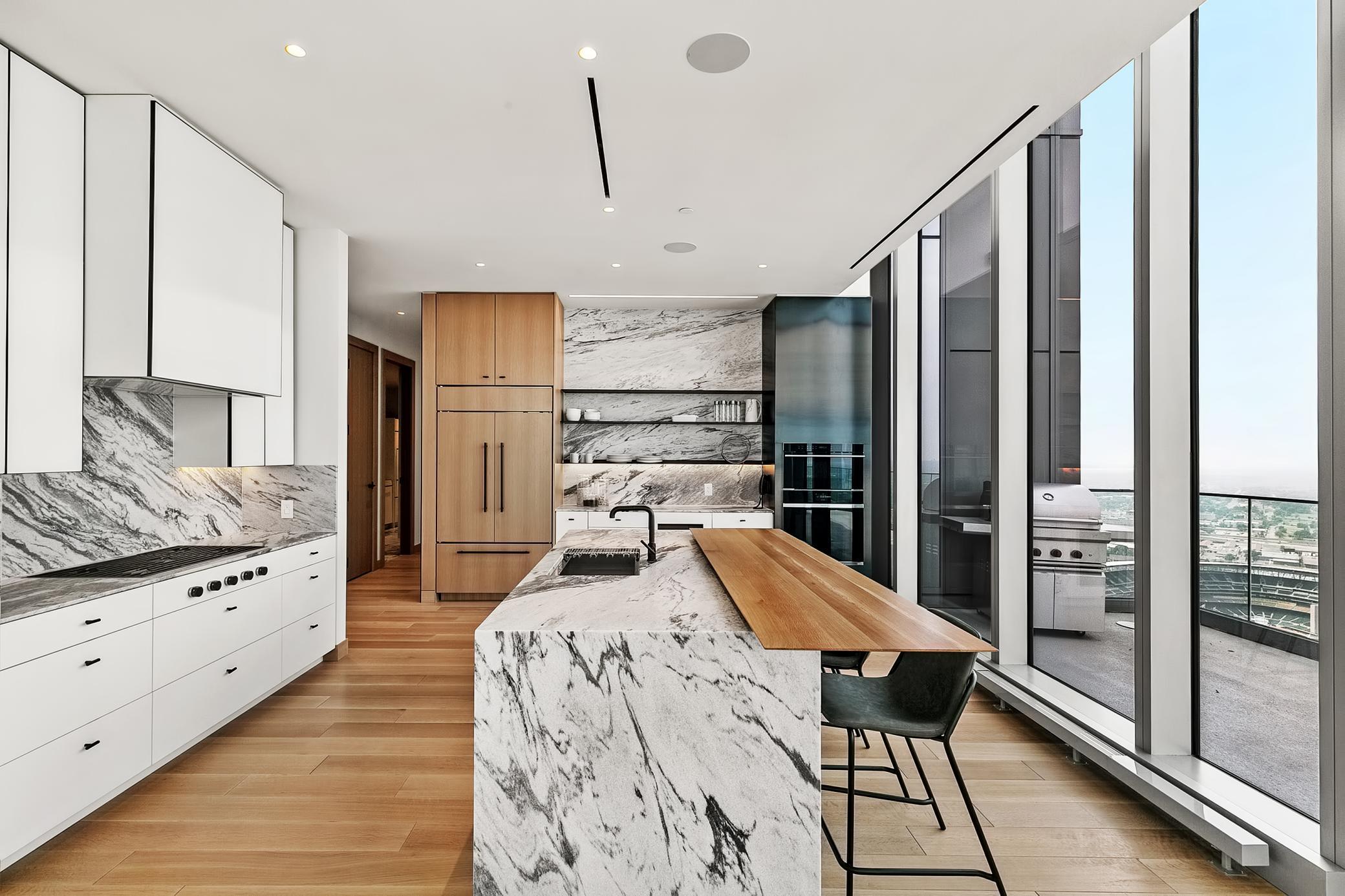 Gourmet kitchen complete with state-of-the-art appliances & extraordinary custom cabinetry & remarkable finishes in every space.