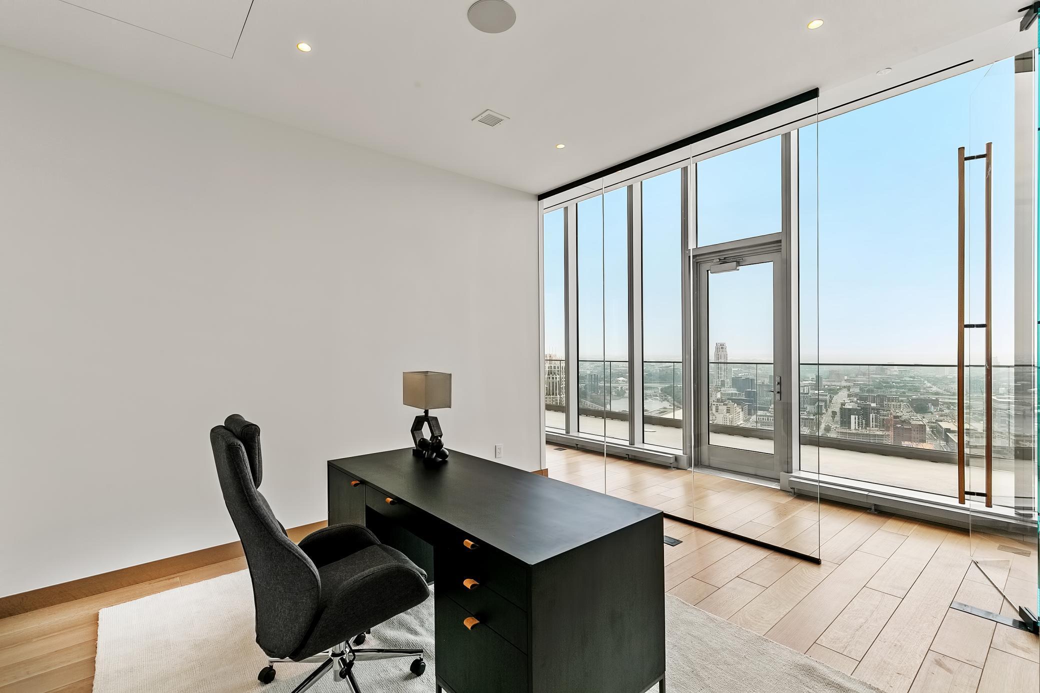 Amazing home office space. Off of the open living space, you'll walk towards an office space with surround glass windows/door. Spacious extra room - great for office, playroom, exercise room.