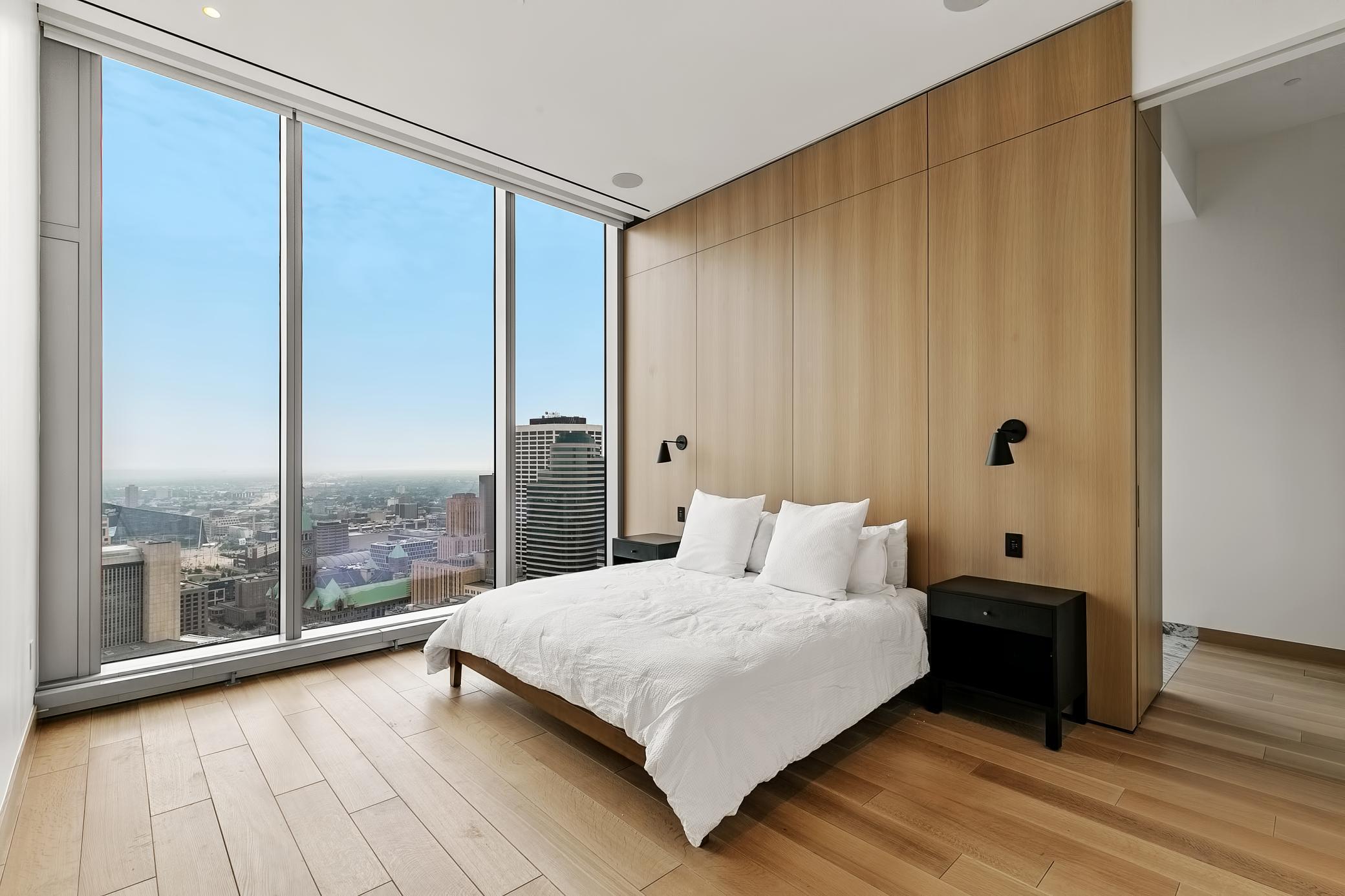 Floor-to-ceiling windows in your lavish Primary Bedroom Suite