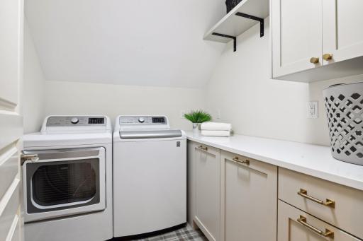 Recently remodeled upper level laundry added counter space and full-size washer and dryer. (Note there is a main level laundry too)