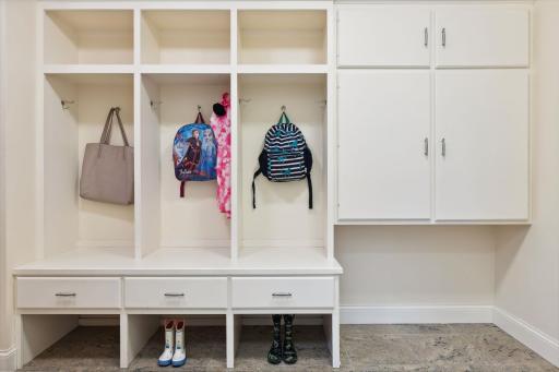 Mudroom has cubbies, closet storage and space for a kennel