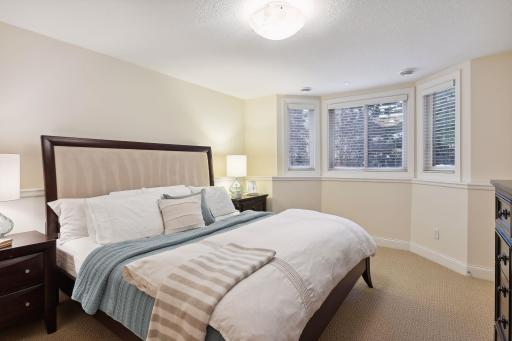 Bedroom #4, one of two on the lower level. Has large windows and is next to 3/4 bath.