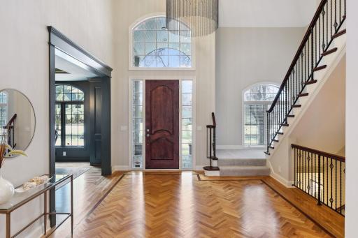 Enter a grand foyer great for entertaining