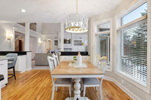 Informal eating area is adjacent to kitchen with full visibility to the living room and backyard