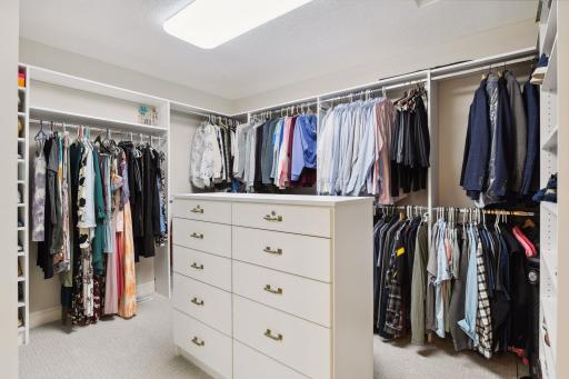 Huge walk-in closet with center island dresser