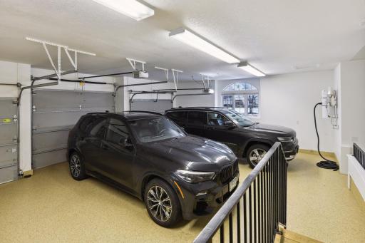 Three car heated garage with central vacuum and built-in storage. Floors are covered in epoxy and feature drains. Access to both mudroom and lower level.
