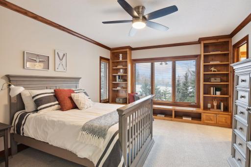 Bedroom #3 with built-ins and window seat. All bedrooms has wooden blinds for privacy.