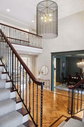Architectural staircase leads to the second floor