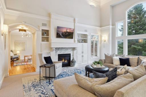Beautiful arched doorway leads to a first floor playroom with visibility from the kitchen and living room