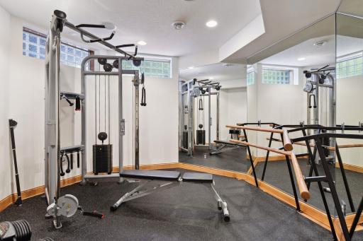 Second workout room with mirrors. Could easily be a dance or yoga studio