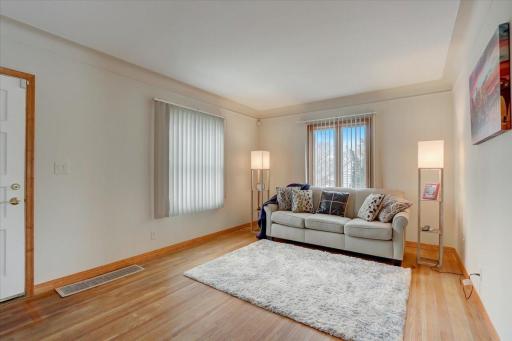 Spacious living room upon entry with beautiful coved ceiling, freshly painted interior throughout.