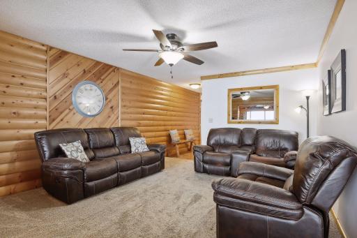 18 x 14 living room with newer carpet and ceiling fan
