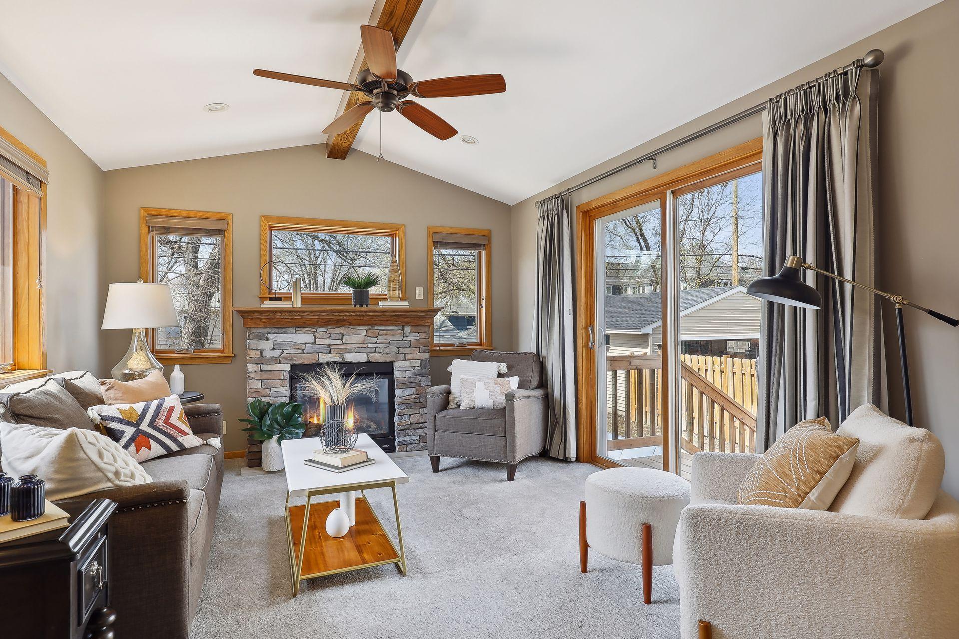 Gas fireplace with stone surround.
