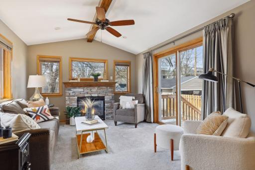 Gas fireplace with stone surround.