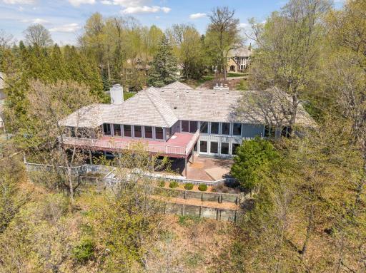 Walls of windows provide elevated panoramic views of Halsted Bay on Lake Minnetonka