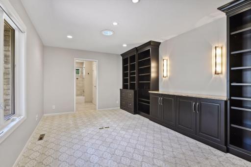 2nd main level bedroom with en-suite bath currently set up as a perfect in home office space