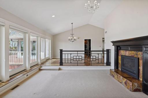 Living and formal dining rooms blend perfectly for entertaining or quiet evenings enjoying a fire and the view