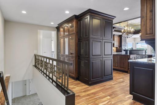 Additional storage and display cabinets make even the back hallway attractive