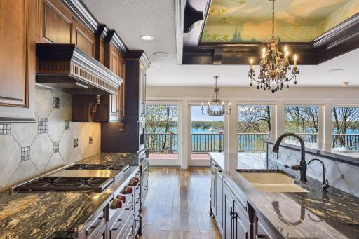Kitchen is a chef's delight featuring a Wolf gas cooktop with built in griddle, 2 dishwashers and panoramic views