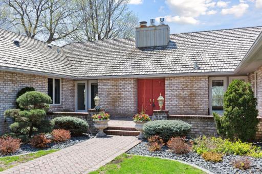 Welcoming entry court yard is the perfect spot for morning coffee or catching up with neighbors out for a walk