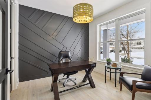 Main level office is great for telecommuting or home business. Photos are from a previously built home.