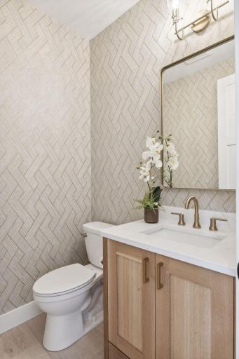 Beautifull main level powder room. Photos are from a previously built home.