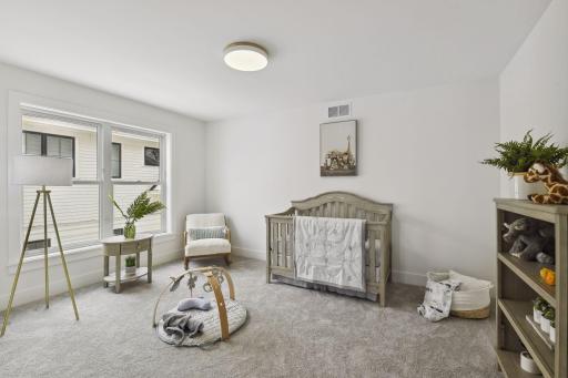 2 additional bedrooms connect by Jack and Jill Bathroom. Photos are from a previously built home.