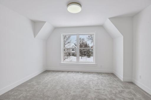 Juniour suite / 4th upper level bedroom with private bathroom and walk-in closet. Photos are from a previously built home.