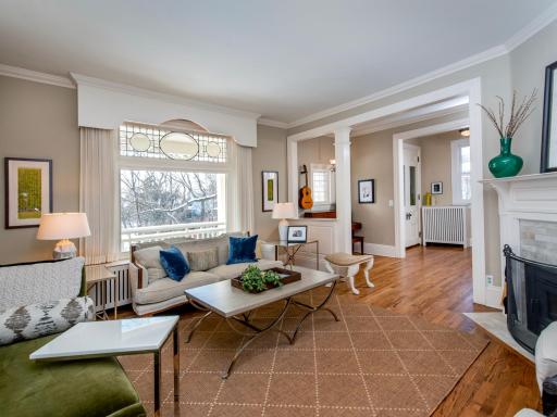 Main Floor Living room with large picture window and leaded glass.
