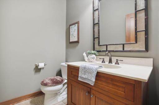 The Powder Room/Half Bath is perfect for guests and is part of the back Foyer hallway.